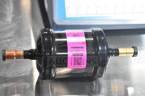 BRAND NEW Sanhua DTG-A08030-002 Liquid Line Filter Drier; minor scratches. Pink label with model and QR code visible.