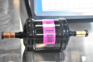 BRAND NEW Sanhua DTG-A08030-002 Liquid Line Filter Drier; minor scratches. Pink label with model and QR code visible.