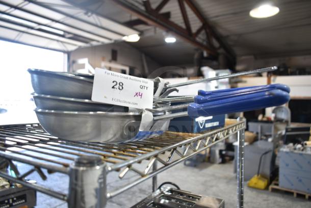 Set of four Vollrath Z4010 10" aluminum non-stick fry pans with CeramiGuard II coating, blue cool handles, new scratch and dent.