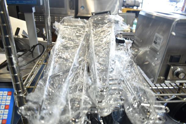 17 brand new solid stainless steel flatware holder cylinders in plastic wrap, scratch and dent condition, with brackets included.