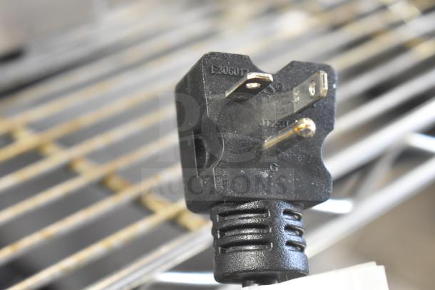 Close-up of Avantco 184THD27208 commercial toaster plug showing model number markings.