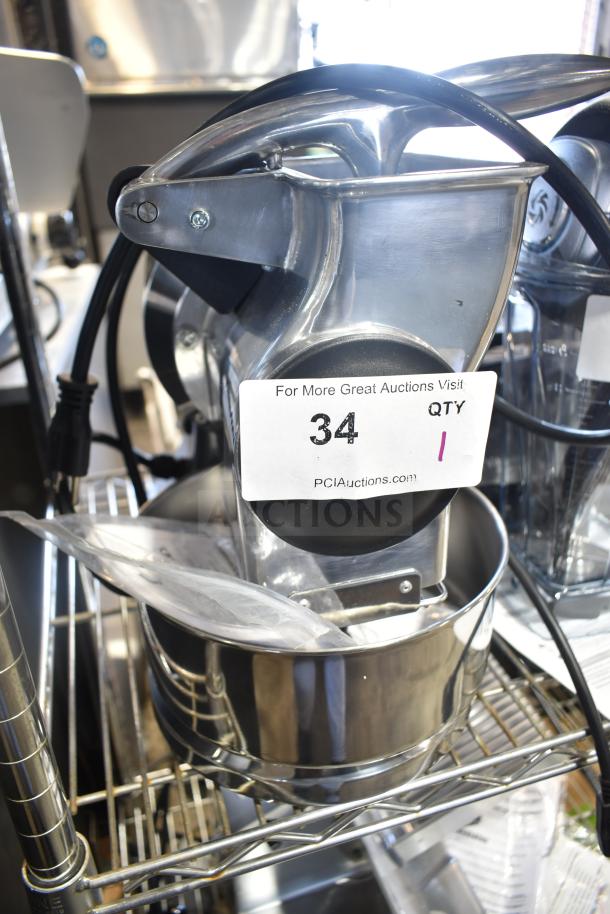 Brand new Estella 348CG112NB electric hard cheese grater, 3.3 lb/min capacity, 110V, 1 phase, visible auction label.