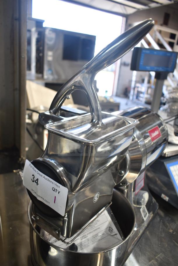 Brand new Estella 348CG112NB electric hard cheese grater, 3.3 lb./min, 110V, 1 phase, minor scratches, auction tag attached.