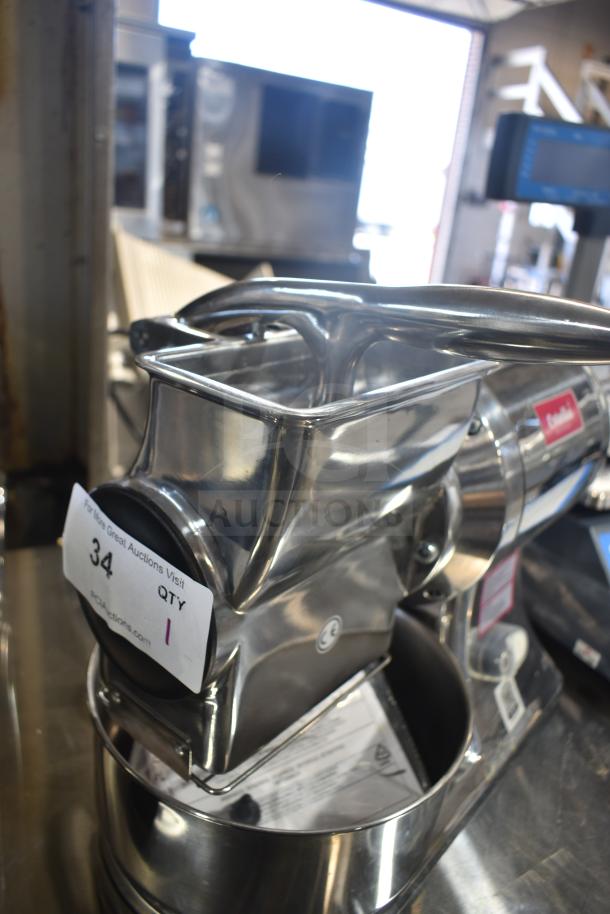 BRAND NEW Estella 348CG112NB electric hard cheese grater, 3.3 lb/min, 110V, scratch and dent, visible auction tag, shiny stainless steel.