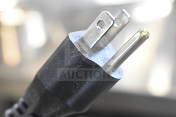 The image shows a close-up of a power plug for the Estella 348CG112NB electric hard cheese grater.