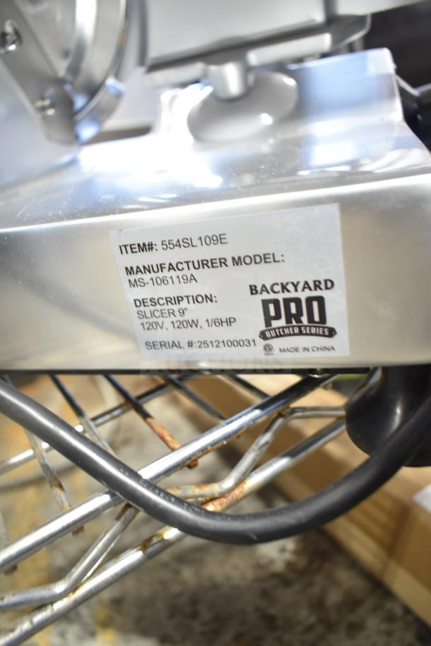 Brand new Backyard Pro MS-106119A 9" meat slicer with blade sharpener. Label shows 120V, 1 Phase, serial 2512100031.