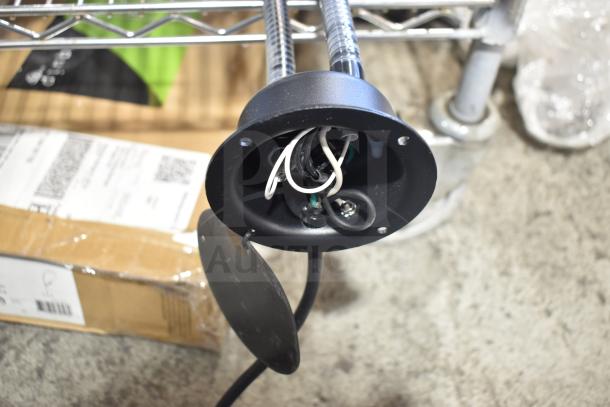 Brand new Avantco Flexible Double Head Warming Lamp, slight scratches and dents, black finish, labeled wires visible.