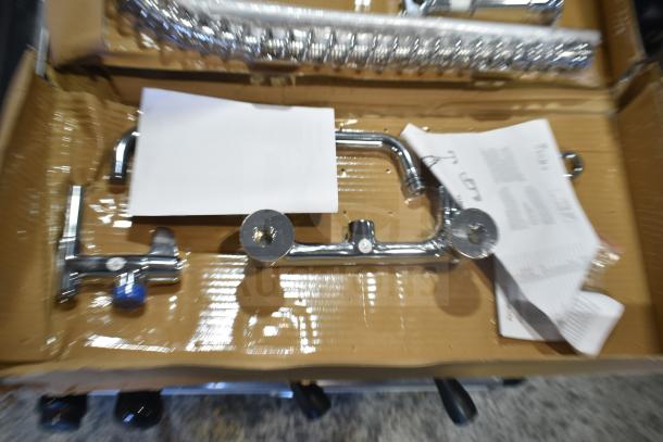 Brand new Equip by T&S 5PR-8W12-C wall-mounted pre-rinse faucet, 35 11/16" high, with accessories in box.