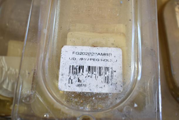 Amber drop-in bin lid, model FG202P22AMBR, with label. Part of tabletop lot, visible wear and scuff marks.