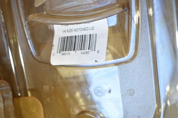 Alt text: Amber-colored bin lid, model FG202P22AMBR, with barcode and "1/4 Size Notched Lid" label.