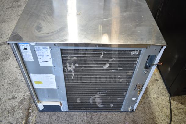 2017 Scotsman C1030SA-32D commercial ice machine head, 208/230V, 1 phase; silver finish, visible wear; includes caution label.