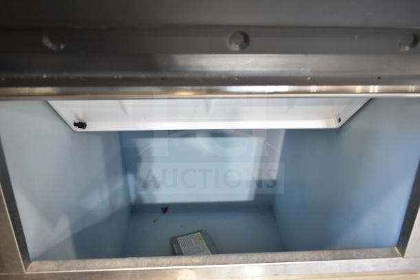 Hoshizaki KML-032-HH commercial ice head on bin, 208-230V, 1 phase, clean condition. Interior view shows spacious bin.