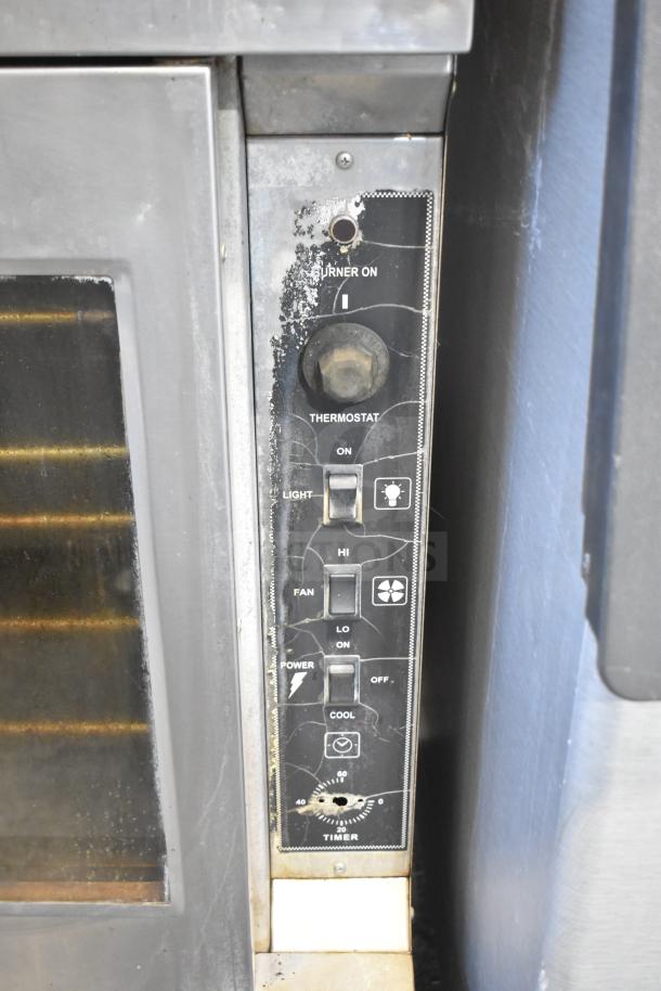Royal commercial convection oven panel showing controls and worn condition. Features thermostatic controls on casters.