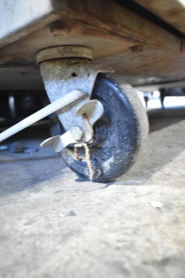 Alt text: Close-up of a commercial oven caster wheel on Royal convection oven, showing wear, suitable for easy mobility.