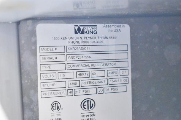 Silver King SKR27AD/C11 commercial cooler label, showing model, serial number, 115 volts, 60 Hz, and ETL listed.