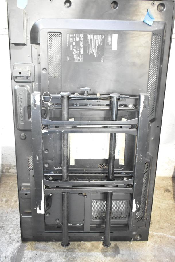 Back view of NEC V463 television with wall mount brackets. Visible labels indicate model specifics. Buyer must pick up.