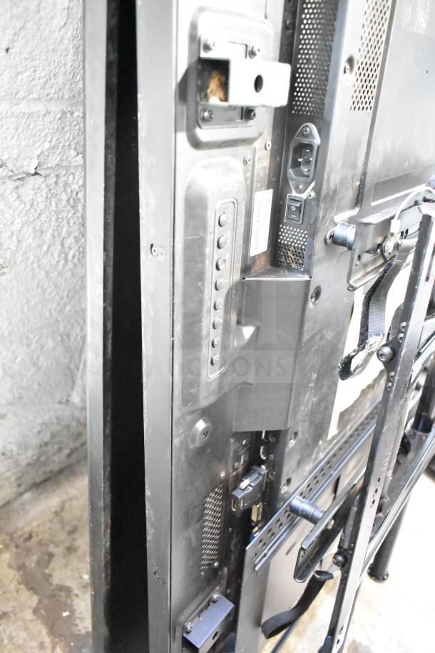 Two NEC V463 televisions, showing rear ports and mounting brackets. Buyer pickup only.