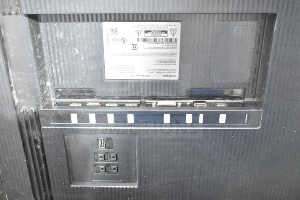 Back panel of NEC V463 TV showing HDMI, DVI, and USB ports, with visible label noting model and specifications.