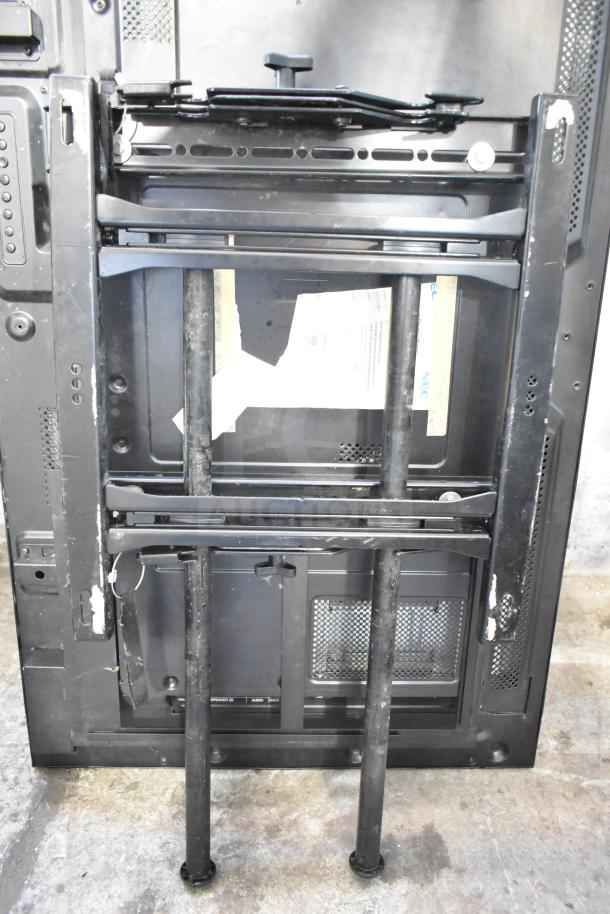 2 NEC V463 televisions, black, used condition with stands; display replacements required; buyer pick-up only.