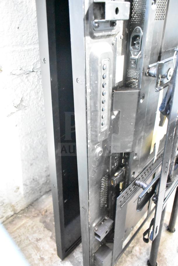 Two NEC V463 televisions, rear view, showing ports and connectors. Local pickup only.