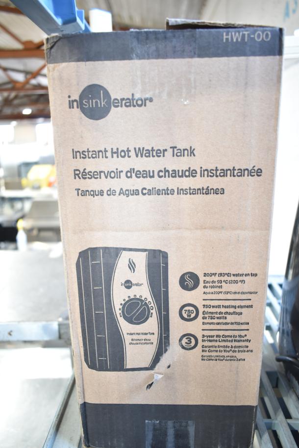 Brand new Insinkerator HWT-00 Instant Hot Water Tank in original box, 750W, 3-year warranty, minor box damage visible.