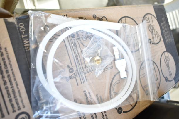 BRAND NEW Insinkerator HWT-00 Instant Hot Water Tank, scratch and dent, includes hoses and fittings.