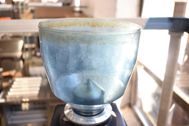 Commercial countertop espresso bean grinder, missing lid, 120 volts, 1 phase, visible wear and residue on hopper.