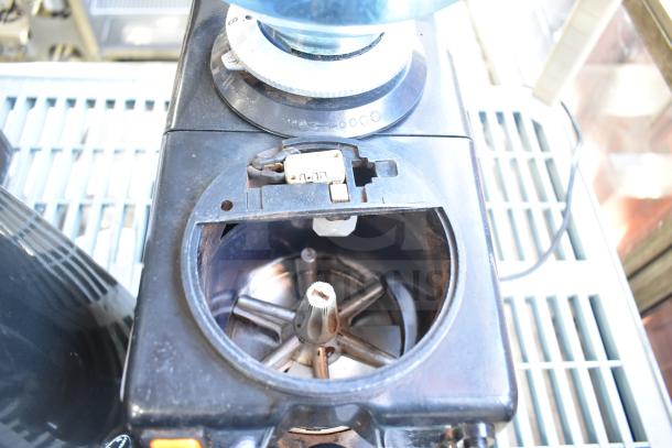 Commercial countertop espresso bean grinder without lid, 120 volts, 1 phase. Visible grind adjustment dial, compact design.