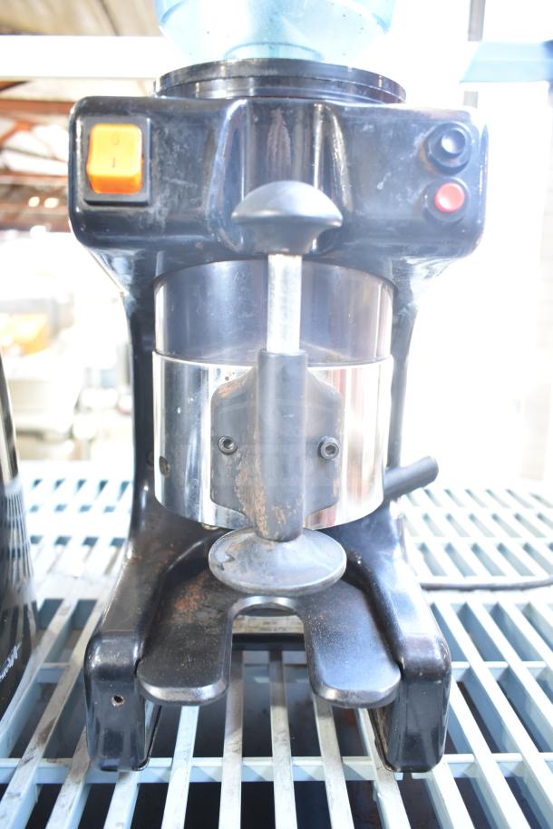 Commercial countertop espresso bean grinder, black and silver, no lid, 120 volts, single-phase, visible wear.