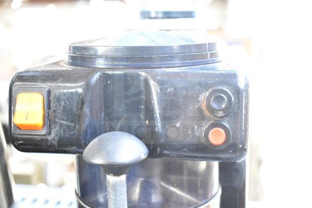 Commercial countertop espresso bean grinder, missing lid. Features control buttons. 120 volts, 1 phase. Used condition.
