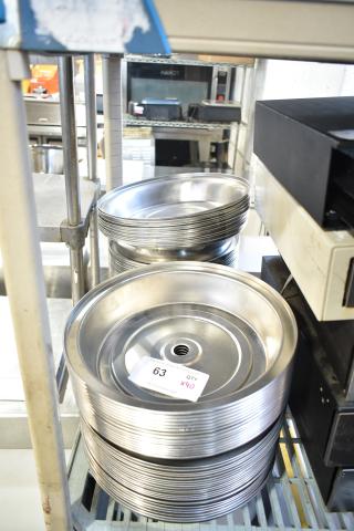 40 metal dome covers on shelves, stackable design, excellent condition. Lot tag indicates "63 QTY x40."