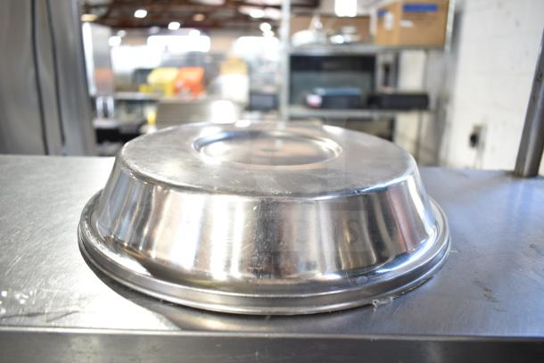 40 metal dome covers, stainless steel, used condition, stackable design, perfect for food service applications.