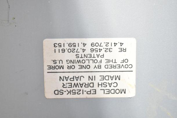 "Model EP-125K-SD cash drawer with visible label indicating patents and 'Made in Japan.' Includes five drawers."