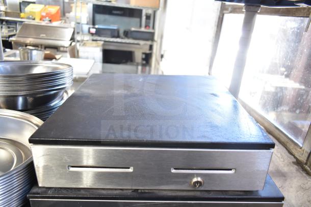 Stainless steel cash drawer with key lock, slot for bills, in used condition. Bundle of 5 cash drawers auctioned.