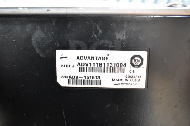 Alt text: "MMF Advantage cash drawer label with part number ADV111B1131004, serial number ADV_151513, made in USA."