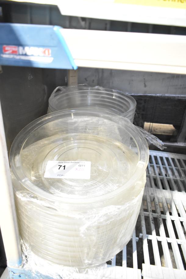 20 clear poly dome covers stacked, wrapped in plastic, in new condition. Label reads "71 QTY x20."