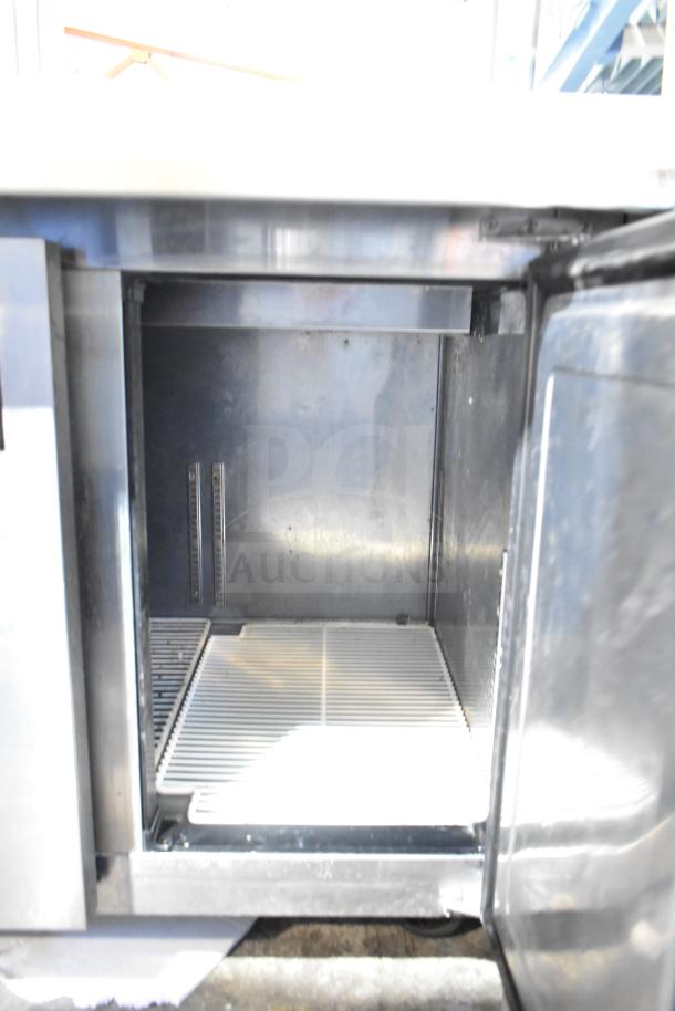 Everest EPPSR2 Commercial Pizza Prep Table with 2-tier over shelf, stainless steel interior, 115 volts, 1 phase.