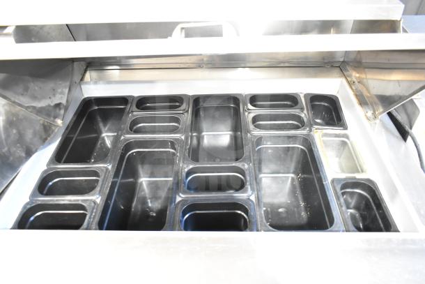 Berg EDMT-72-30 commercial sandwich salad prep table with multiple black food pans, stainless steel surface, 115V, 1 Phase.