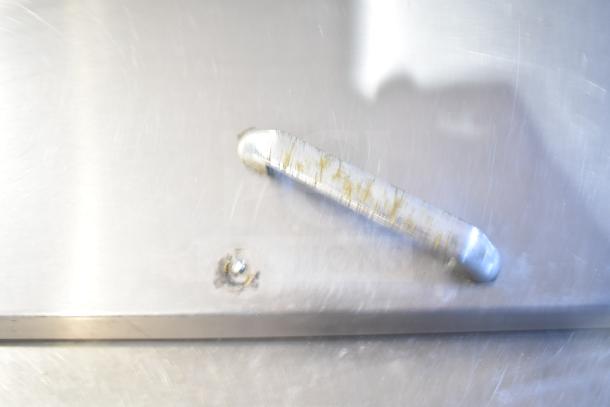 Berg EDMT-72-30 sandwich salad prep table handle detail with visible wear.