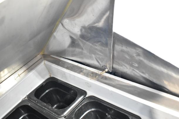 Berg EDMT-72-30 Sandwich Salad Prep Table, stainless steel, visible wear, includes black food containers. 115V, 1 phase.