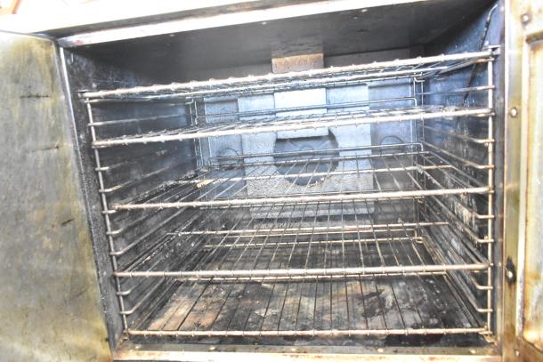 Royal RCOS-1 commercial natural gas convection oven interior with racks, view through door, used condition.