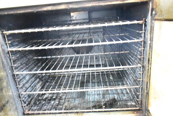 Royal RCOS-1 full-size natural gas convection oven with interior racks and thermostatic controls in used condition.