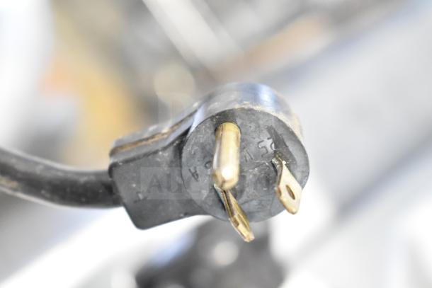 Delfield 406-CA undercounter cooler plug, 115 volts, 1 phase, black with visible wear.