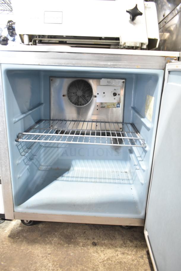 Delfield 406-CA commercial single door cooler, undercounter, 115V, 1 phase, visible wire shelf, interior fan, and UL label.