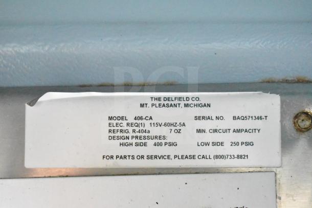 Delfield 406-CA undercounter cooler label, showing model, electrical requirements, refrigerant type, and service info.