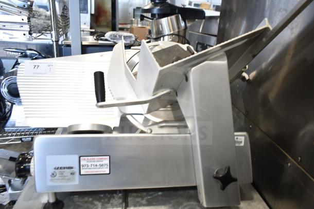 Bizerba commercial countertop meat slicer, 120 volts, 1 phase, in good condition. Features include adjustable blade and safety guard.