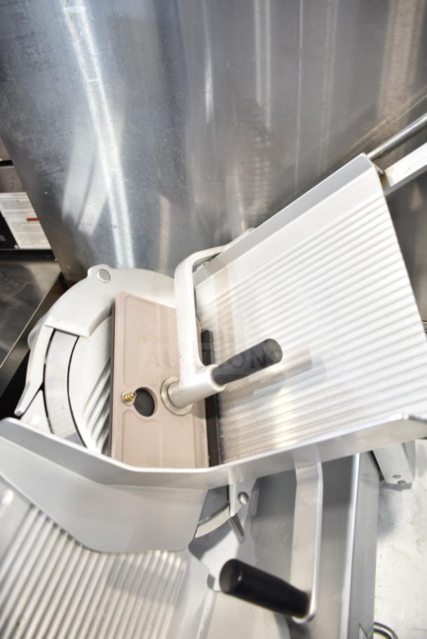 Bizerba commercial countertop meat slicer, 120 volts, 1 phase, features sturdy build, excellent condition.