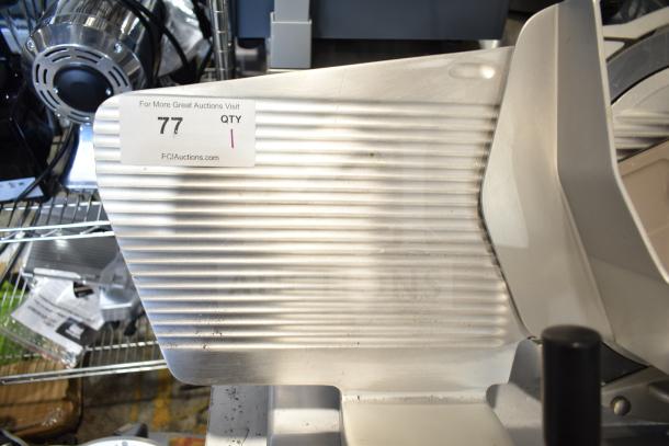 Bizerba commercial countertop meat slicer, 120 volts, 1 phase, stainless steel, used condition. Auction label: QTY 1, 77.