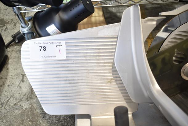 Bizerba SE 12 D Commercial Countertop Meat Slicer, 120 Volts, 1 Phase, showing cutting blade and metal body, tag visible.