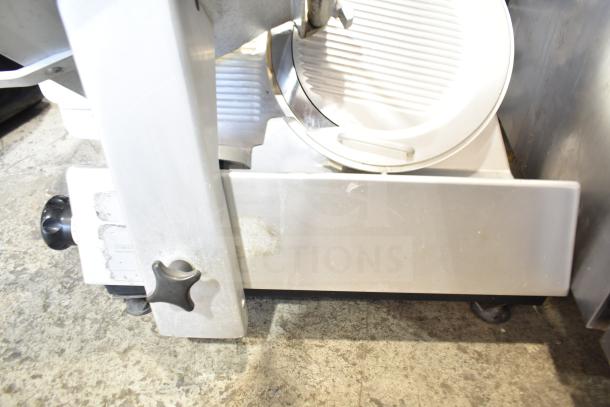 Bizerba SE 12 D commercial countertop meat slicer, 120 volts, 1 phase, showing blade and adjustment knob, used condition.